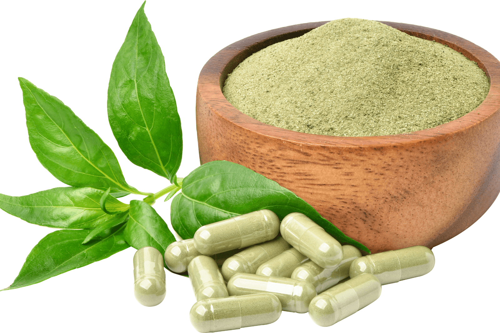 Bowl of green herbal powder with capsules and fresh leaves on a white background.